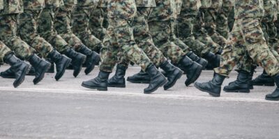 men in green and brown camouflage uniform