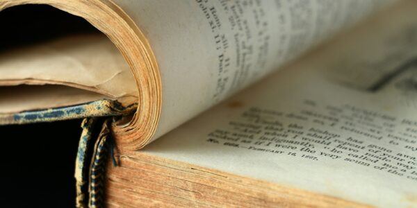an open book laying on top of an open book
