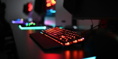 a computer keyboard sitting on top of a desk