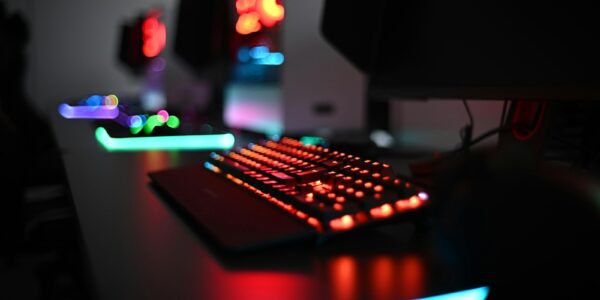 a computer keyboard sitting on top of a desk