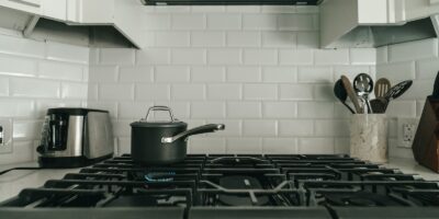 a kitchen with a stove and a pot on the stove