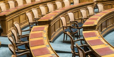 brown wooden chairs on blue and brown wooden floor